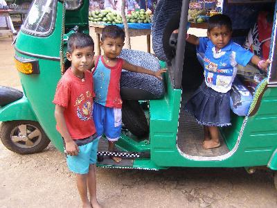 Local kids on a tuktuk